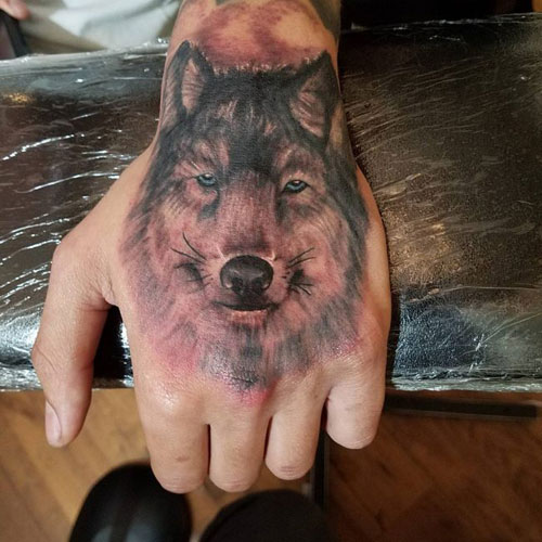 Awesome Wolf Hand Tattoo Designs