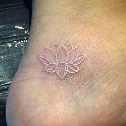 White Ink Lotus Flower Tattoo