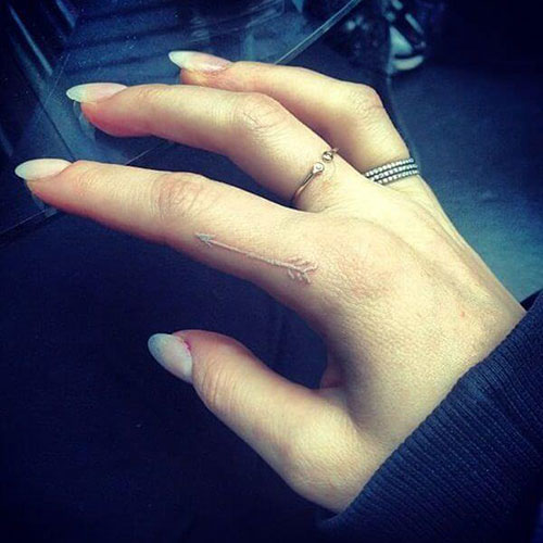 White Ink Side Finger Tattoo