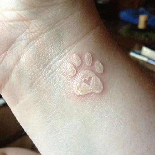 White Ink Paw Tattoo