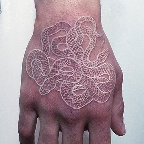 White Ink Hand Tattoo