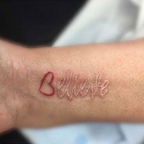 White Ink Word Tattoo