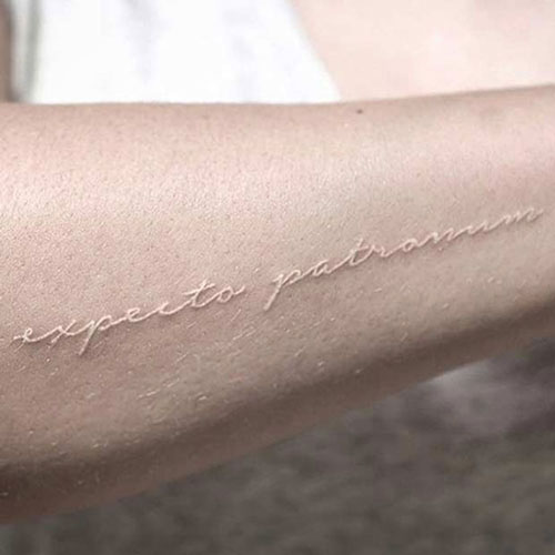 Cool White Forearm Tattoo