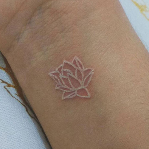 Cute Small White Ink Tattoo