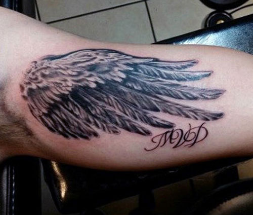 Feathers Inside Bicep Tattoo