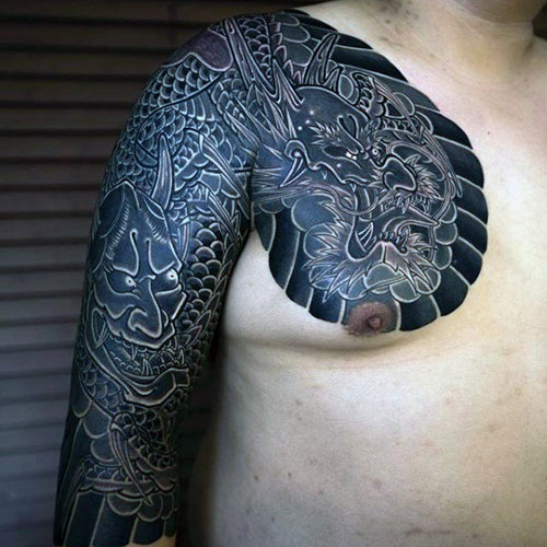 Chest and Half Sleeve Tattoo