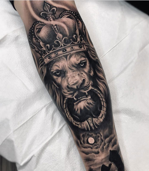 Badass Lion Forearm Tattoo with Crown